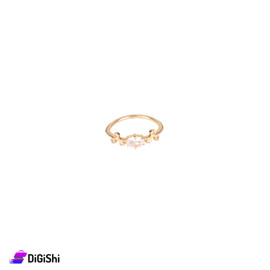 A Thin Gold Ring With Zirconium Beads And An Oval Stone